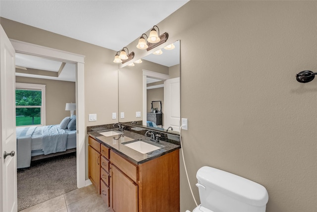 2501 NE Ewing Ct, Grimes, IA 50111 - ensuite bathroom featuring double vanity and tile patterned floors