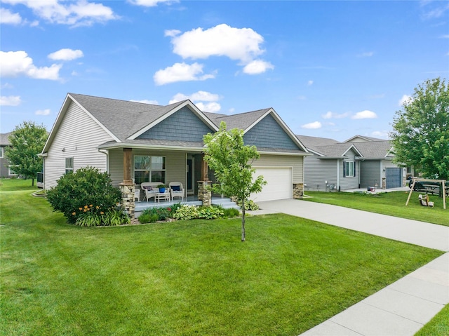2501 NE Ewing Ct, Grimes, IA 50111 - craftsman inspired home with a porch, an attached garage, a front lawn, driveway, and stone siding