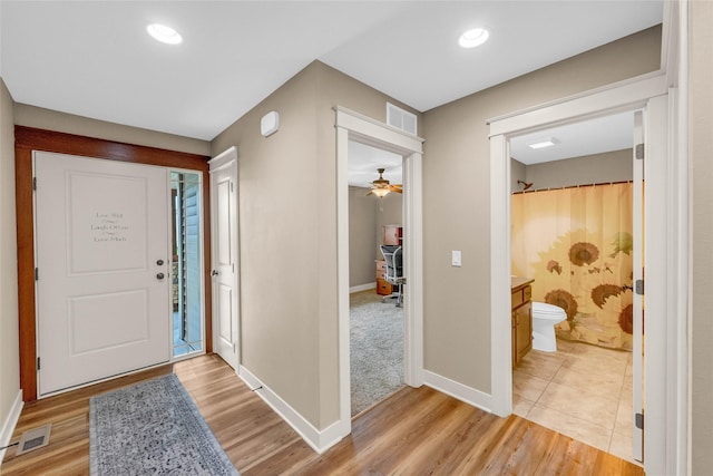 2501 NE Ewing Ct, Grimes, IA 50111 - foyer with light wood-style floors, a ceiling fan, and recessed lighting