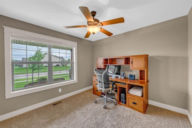 2501 NE Ewing Ct, Grimes, IA 50111 - carpeted home office featuring baseboards and ceiling fan