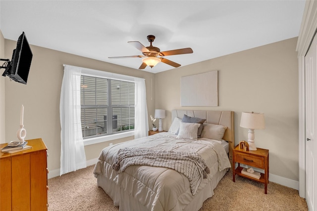 2501 NE Ewing Ct, Grimes, IA 50111 - bedroom with light carpet, a closet, and ceiling fan