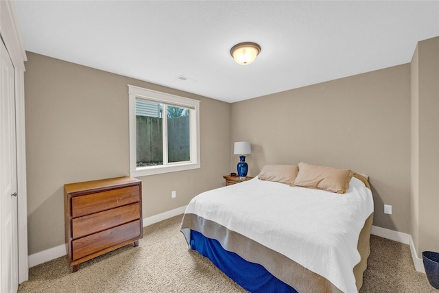 2501 NE Ewing Ct, Grimes, IA 50111 - carpeted bedroom featuring baseboards