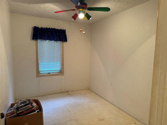 3419 E 37th St, Des Moines, IA 50317 - unfurnished room with a textured ceiling, carpet flooring, and ceiling fan