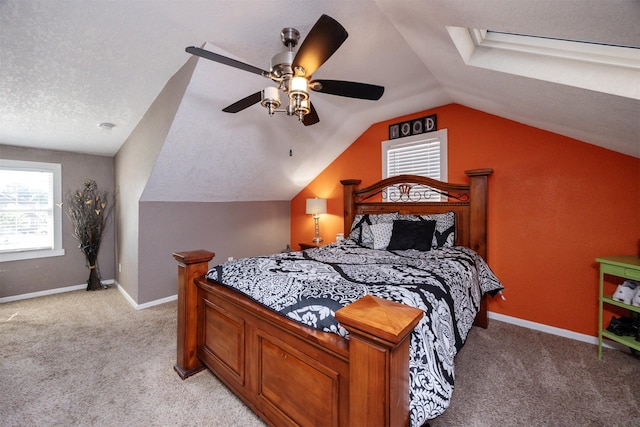 524 1st St, West Des Moines, IA 50265 - bedroom featuring multiple windows, light carpet, lofted ceiling, and ceiling fan