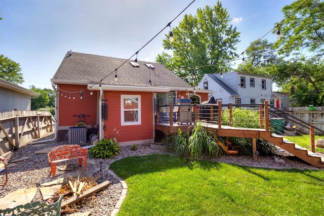 524 1st St, West Des Moines, IA 50265 - rear view of property featuring a wooden deck and roof with shingles