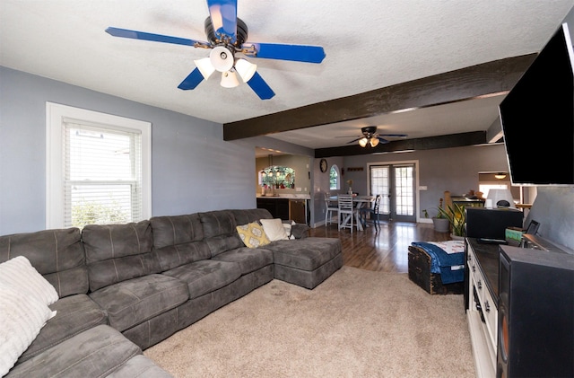 524 1st St, West Des Moines, IA 50265 - carpeted living area with ceiling fan, beam ceiling, and wood finished floors