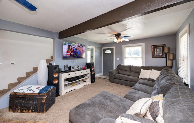 524 1st St, West Des Moines, IA 50265 - living room featuring carpet, stairway, plenty of natural light, a ceiling fan, and beamed ceiling