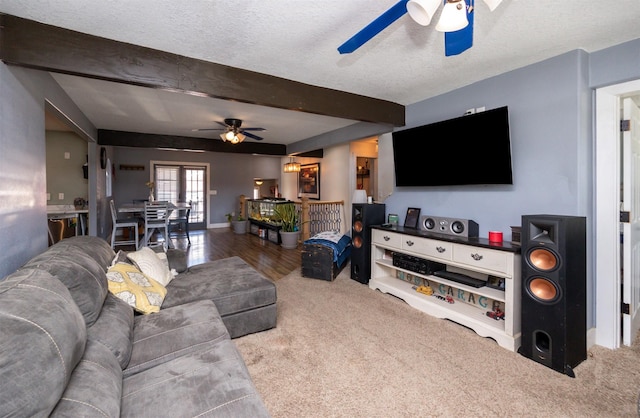 524 1st St, West Des Moines, IA 50265 - carpeted living area featuring ceiling fan, beamed ceiling, and a textured ceiling