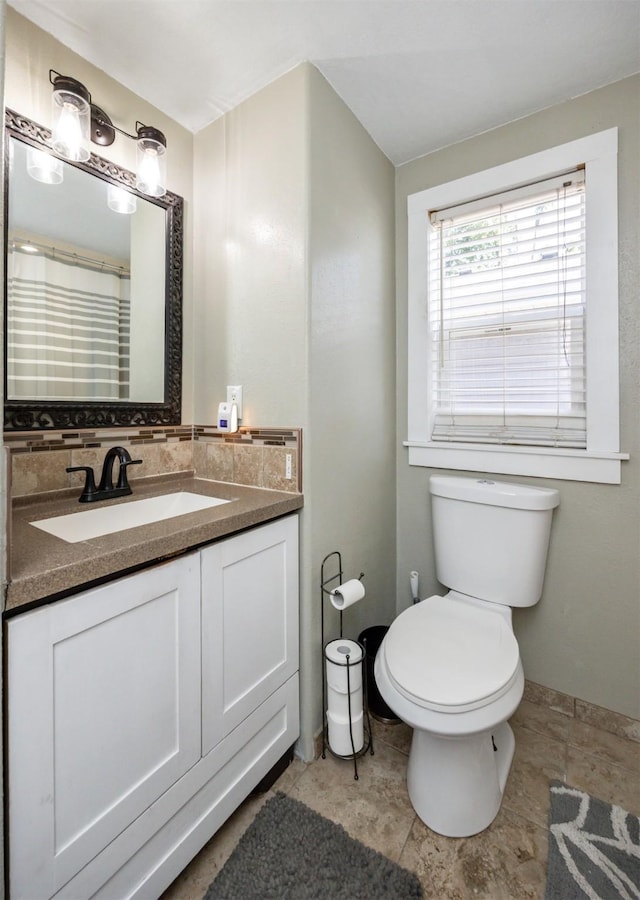524 1st St, West Des Moines, IA 50265 - bathroom with vanity and stone finish flooring