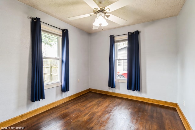 4512 Hickman Rd, Des Moines, IA 50310 - empty room featuring dark wood finished floors, ceiling fan, and a textured ceiling