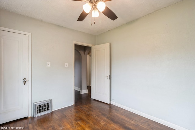 4512 Hickman Rd, Des Moines, IA 50310 - unfurnished bedroom featuring dark wood-type flooring and ceiling fan