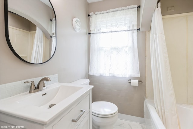 4512 Hickman Rd, Des Moines, IA 50310 - bathroom featuring vanity, marble look tile flooring, and shower / bath combo