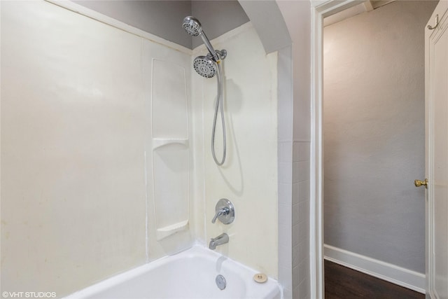 4512 Hickman Rd, Des Moines, IA 50310 - bathroom with shower / bath combination and wood finished floors