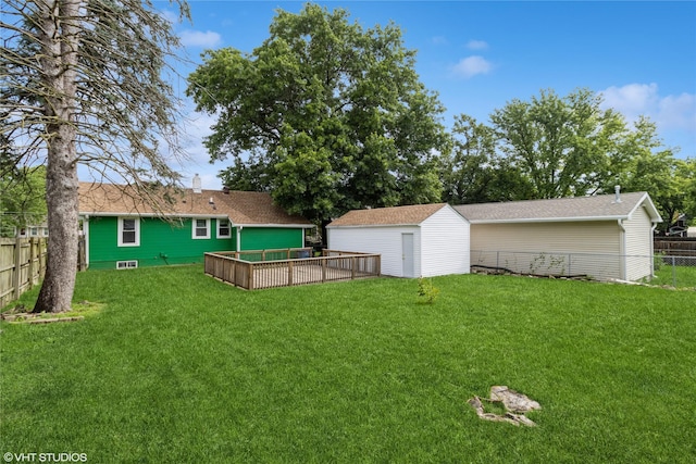 4512 Hickman Rd, Des Moines, IA 50310 - fenced backyard with a storage unit and a garage