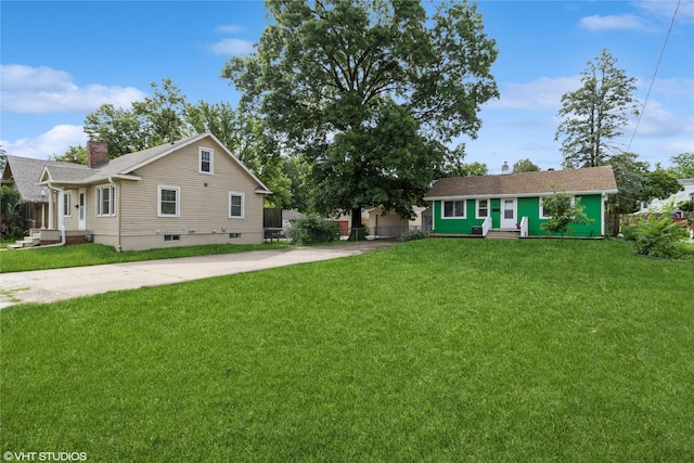 4512 Hickman Rd, Des Moines, IA 50310 - view of front of house with driveway, a chimney, and entry steps