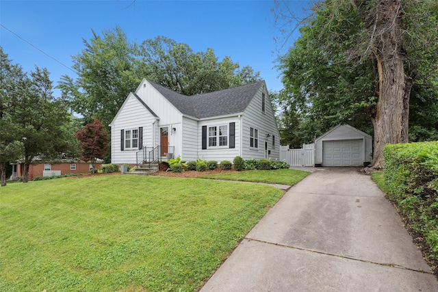 4004 Franklin Ave, Des Moines, IA 50310 - view of front of home with concrete driveway, a shingled roof, an outbuilding, a garage, and a front lawn