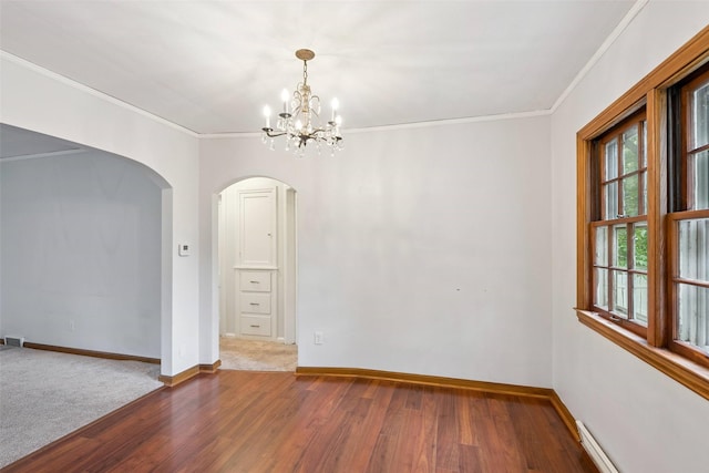 4004 Franklin Ave, Des Moines, IA 50310 - empty room featuring arched walkways, wood finished floors, crown molding, a chandelier, and a baseboard radiator