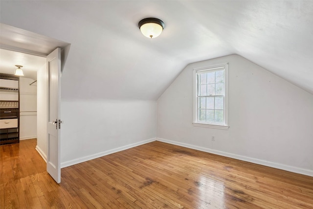 4004 Franklin Ave, Des Moines, IA 50310 - bonus room with hardwood / wood-style flooring and vaulted ceiling