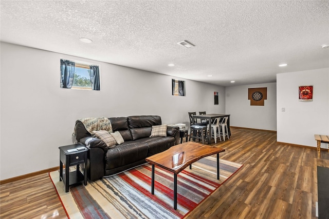 9421 NE 28th Ct, Ankeny, IA 50021 - living area with a textured ceiling, wood finished floors, and recessed lighting