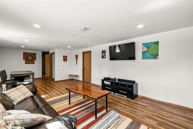 9421 NE 28th Ct, Ankeny, IA 50021 - living area with wood finished floors, recessed lighting, and a textured ceiling