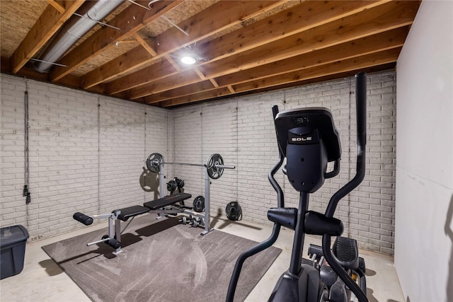 9421 NE 28th Ct, Ankeny, IA 50021 - workout room featuring brick wall
