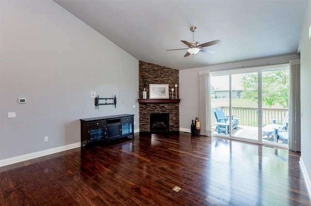 938 15th St SE, Altoona, IA 50009 - living area featuring lofted ceiling, a ceiling fan, wood finished floors, and a stone fireplace
