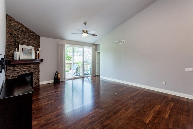 938 15th St SE, Altoona, IA 50009 - unfurnished living room featuring high vaulted ceiling, a ceiling fan, a stone fireplace, and dark wood-style flooring