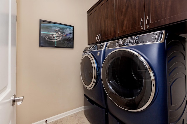 938 15th St SE, Altoona, IA 50009 - laundry room with cabinet space, washing machine and clothes dryer, and light tile patterned floors