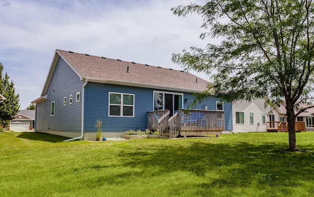 938 15th St SE, Altoona, IA 50009 - back of house featuring a deck, a yard, and a shingled roof