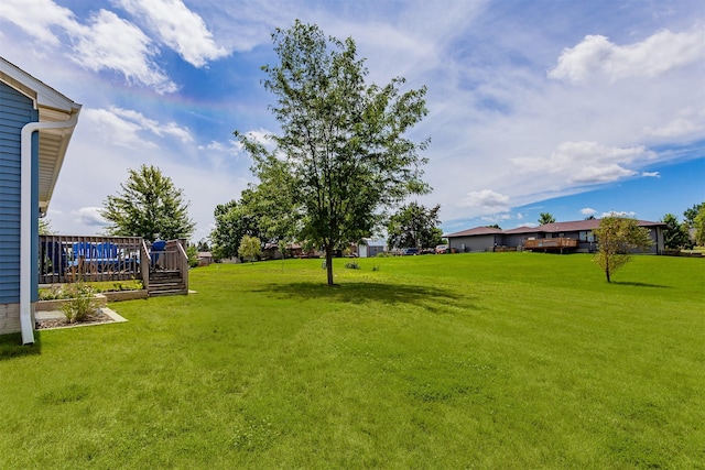 938 15th St SE, Altoona, IA 50009 - view of green lawn with a deck