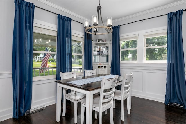 2610 Westover Blvd, Des Moines, IA 50322 - dining area with a chandelier, ornamental molding, a decorative wall, and dark wood-type flooring