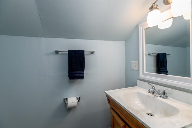 2610 Westover Blvd, Des Moines, IA 50322 - bathroom with vaulted ceiling and vanity