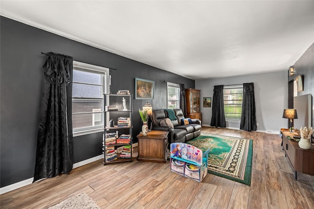 1416 Clinton Ave, Des Moines, IA 50313 - living area featuring wood finished floors and baseboards