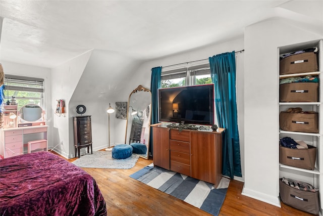 1416 Clinton Ave, Des Moines, IA 50313 - bedroom featuring wood finished floors and vaulted ceiling