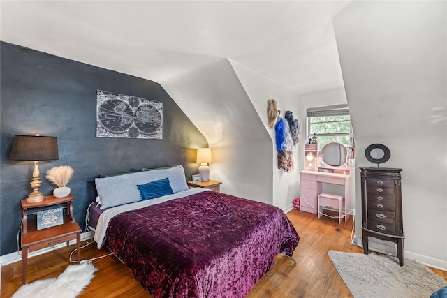 1416 Clinton Ave, Des Moines, IA 50313 - bedroom featuring hardwood / wood-style flooring and vaulted ceiling