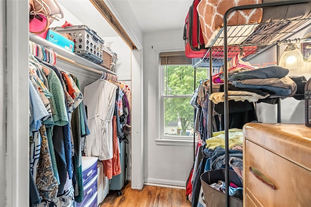 1416 Clinton Ave, Des Moines, IA 50313 - walk in closet featuring wood finished floors