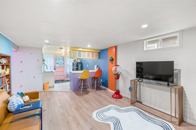 1416 Clinton Ave, Des Moines, IA 50313 - living room with light wood-style floors and recessed lighting
