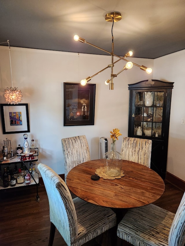 2904 48th St, Des Moines, IA 50310 - dining space featuring a chandelier and wood finished floors