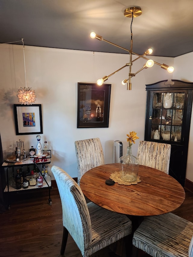 2904 48th St, Des Moines, IA 50310 - dining room featuring wood finished floors and a chandelier