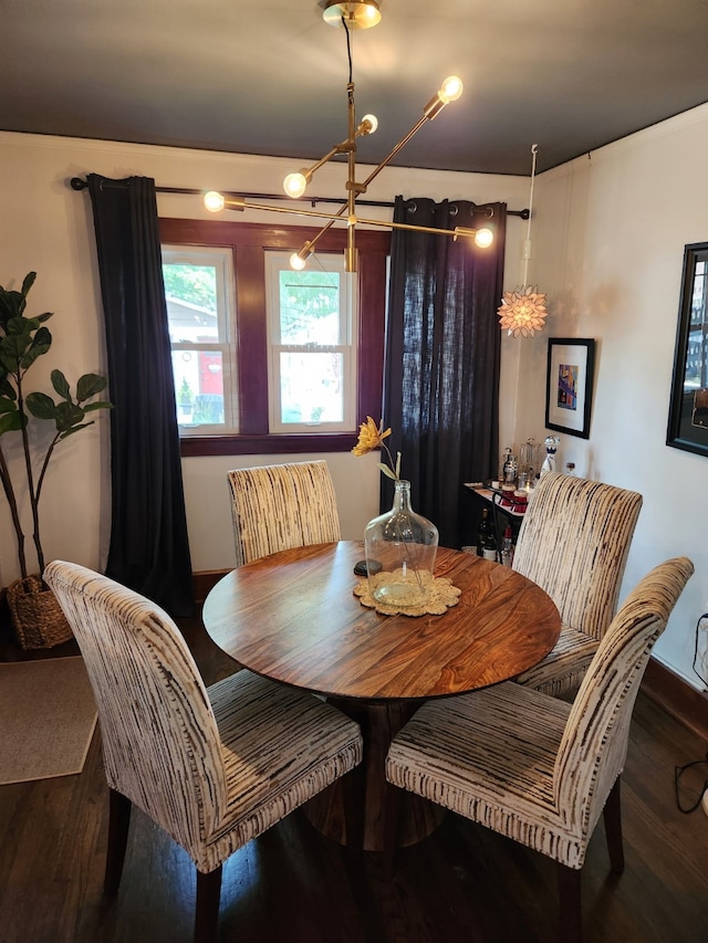 2904 48th St, Des Moines, IA 50310 - dining room featuring wood finished floors and a chandelier