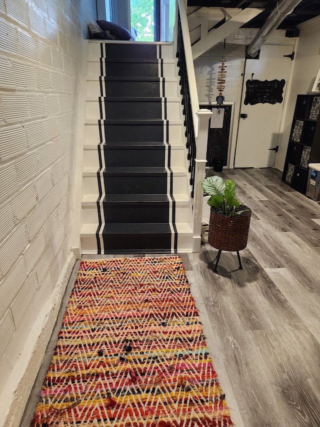 2904 48th St, Des Moines, IA 50310 - staircase featuring wood finished floors