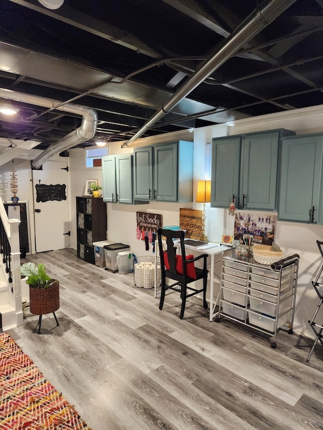 2904 48th St, Des Moines, IA 50310 - finished basement featuring light wood-style floors and stairway