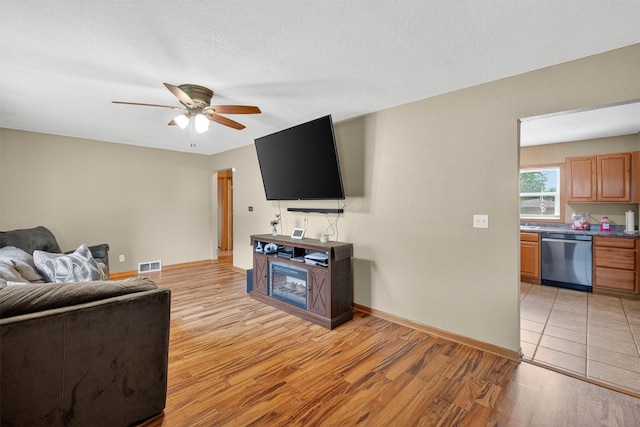 8026 Crestview Dr, Des Moines, IA 50320 - living area featuring light wood-type flooring and ceiling fan