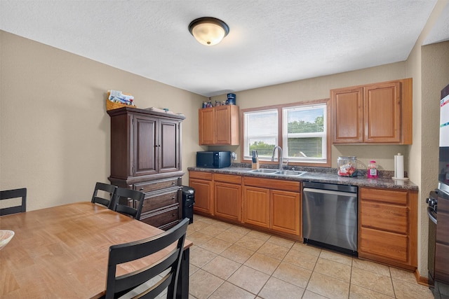 8026 Crestview Dr, Des Moines, IA 50320 - kitchen featuring dishwasher, light tile patterned flooring, dark countertops, a textured ceiling, and oven