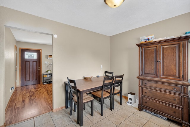 8026 Crestview Dr, Des Moines, IA 50320 - dining space with baseboards and light tile patterned floors
