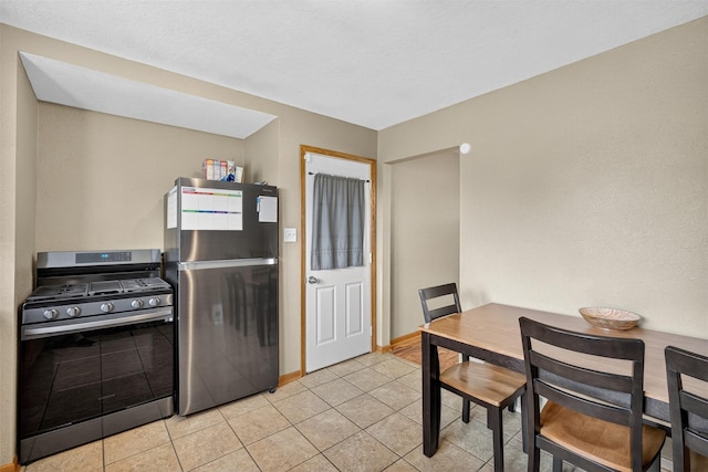8026 Crestview Dr, Des Moines, IA 50320 - kitchen with stainless steel appliances and light tile patterned floors