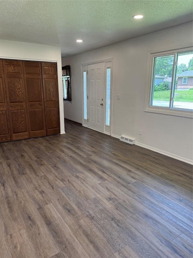 435 E Watrous Ave, Des Moines, IA 50315 - entryway with dark wood-type flooring, recessed lighting, and a textured ceiling