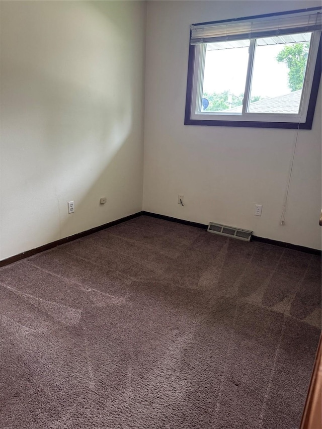 435 E Watrous Ave, Des Moines, IA 50315 - unfurnished room featuring dark carpet