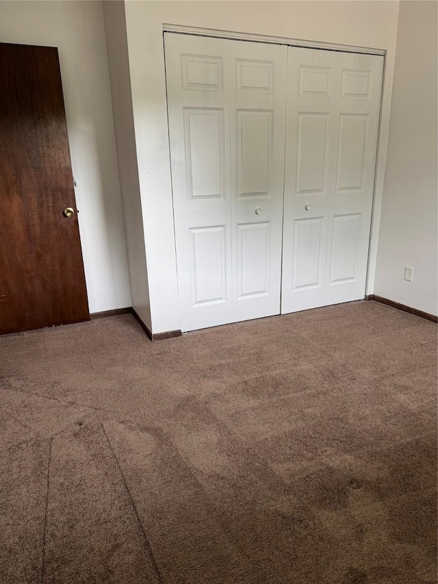 435 E Watrous Ave, Des Moines, IA 50315 - unfurnished bedroom featuring carpet floors and a closet