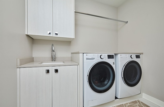 605 S Tiburon Cv, West Des Moines, IA 50266 - washroom featuring cabinet space and washing machine and dryer